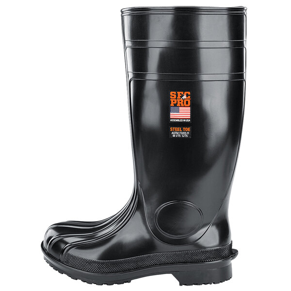 A black rubber Shoes For Crews work boot with an orange logo.