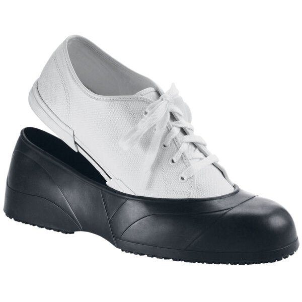 A pair of black Shoes For Crews CrewGuard overshoes.