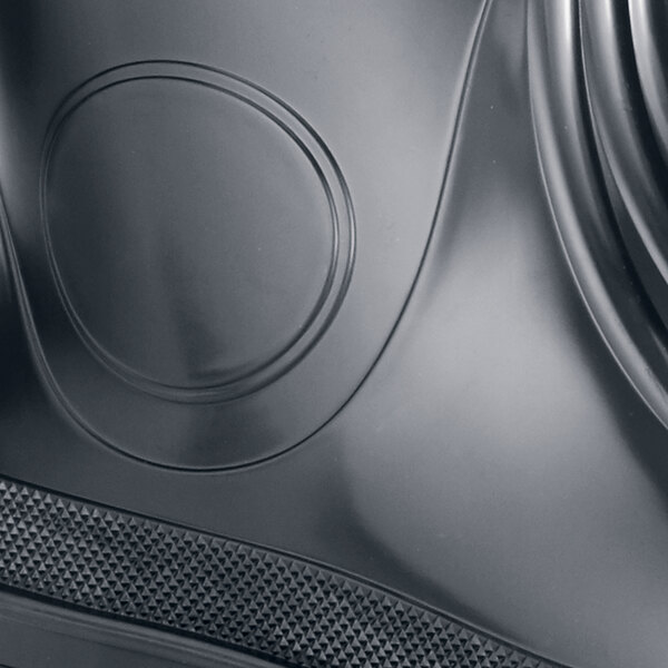 A close up of a black Shoes For Crews Guardian IV work boot.