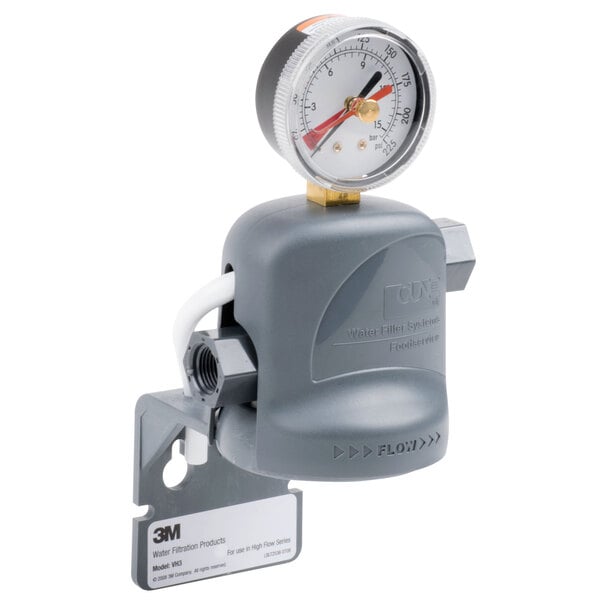 A 3M Water Filtration Products valve head with a grey pressure gauge and shroud.
