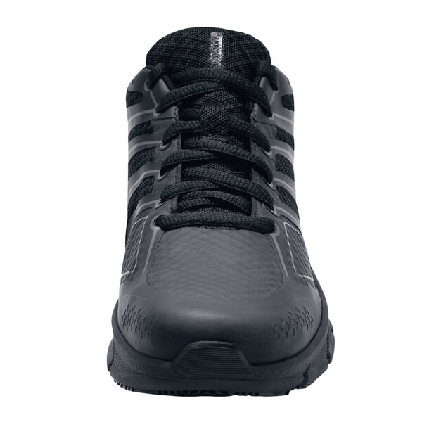 A close-up of a black Women's Shoes For Crews athletic shoe with laces.