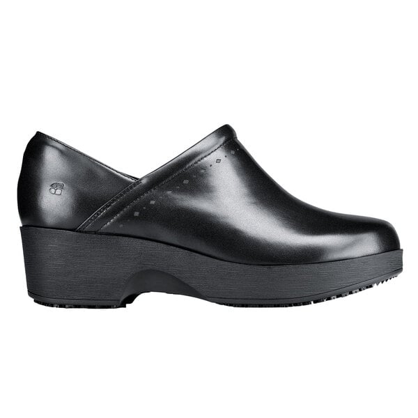 A black leather shoe with a thick rubber sole.