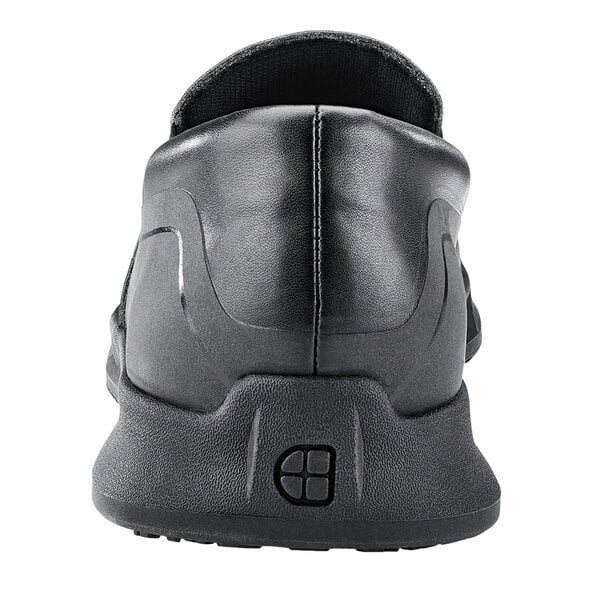 A black Shoes For Crews slip-on men's shoe with a rubber sole.