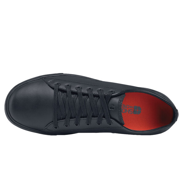 A black Shoes For Crews Old School Low Rider IV men's shoe with red laces.