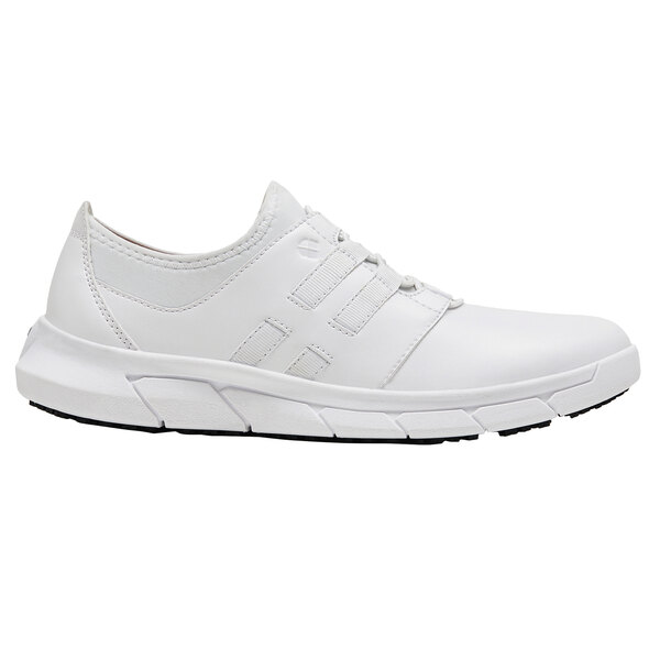 A white Shoes For Crews water-resistant athletic shoe with a black sole.