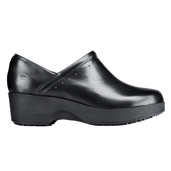 a black leather shoe with a high heel