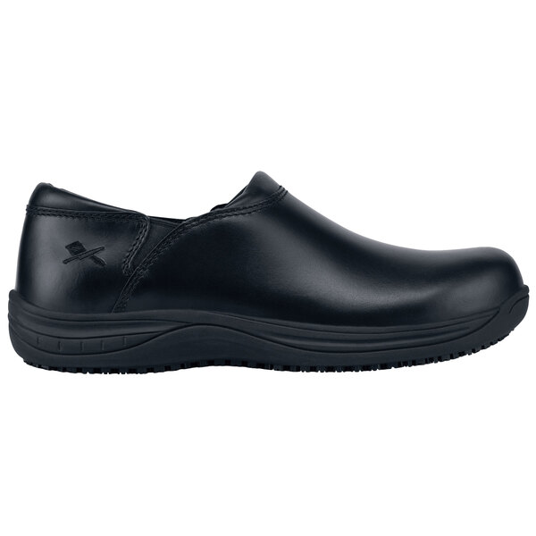 A black MOZO slip-on shoe with a black rubber sole.