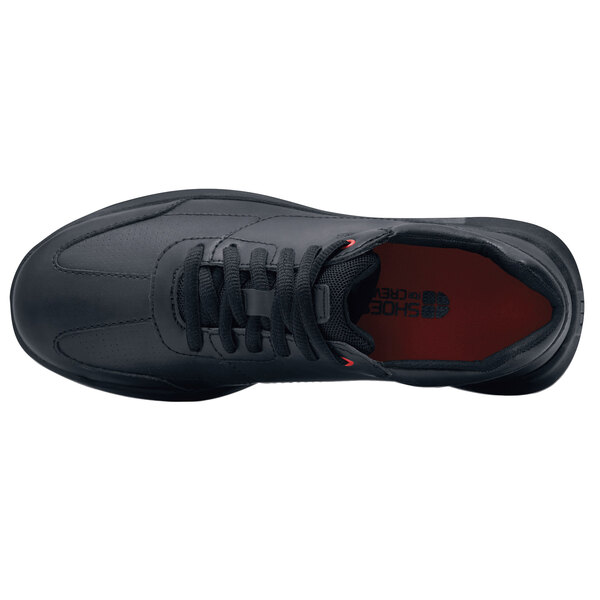 A black water-resistant non-slip athletic shoe with red and white stripes on the sole.