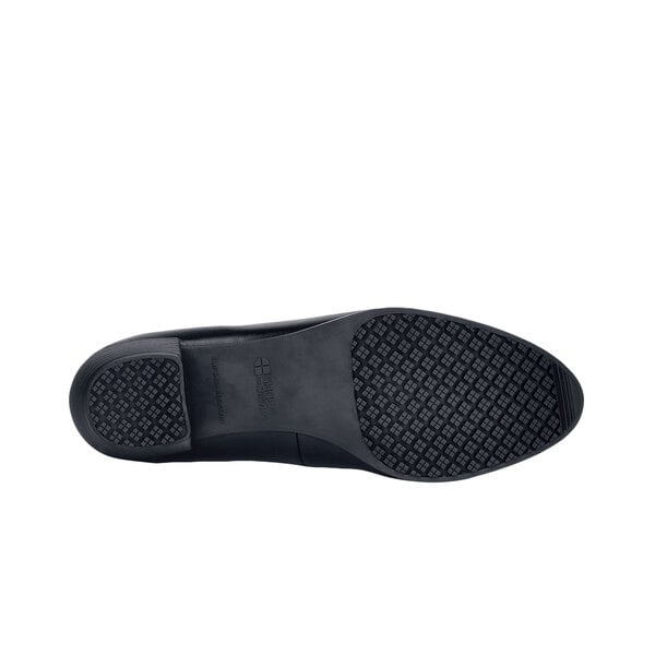 A black leather Shoes For Crews Vita dress shoe with a black sole on a white background.