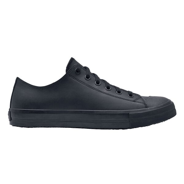 A black leather Shoes For Crews Delray men's shoe with laces on a table.