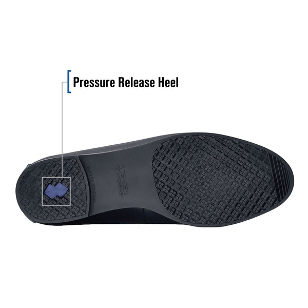 The sole of a black Shoes For Crews Reese dress shoe for women with a pressure release heel.
