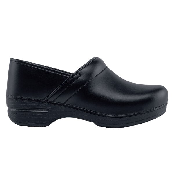 A close-up of a black leather Dansko clog with a rubber sole.