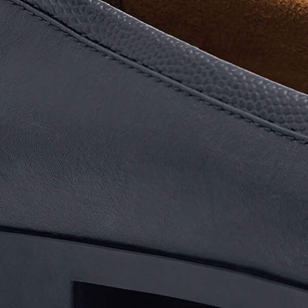 A close up of the black sole of a Shoes For Crews Reese women's dress shoe.
