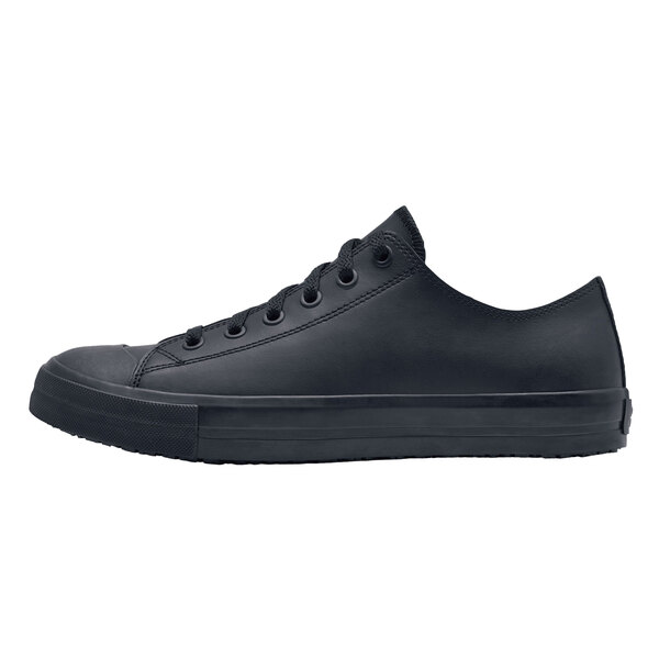 A black Shoes For Crews Delray women's casual shoe with laces.