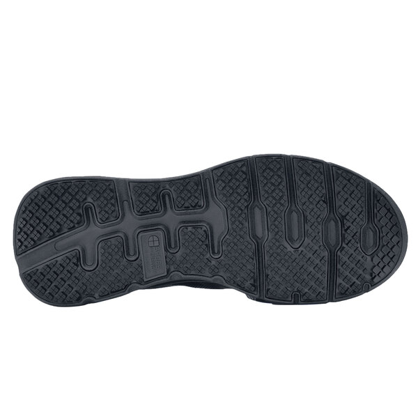 The black rubber sole of a Shoes For Crews Vitality II women's shoe.