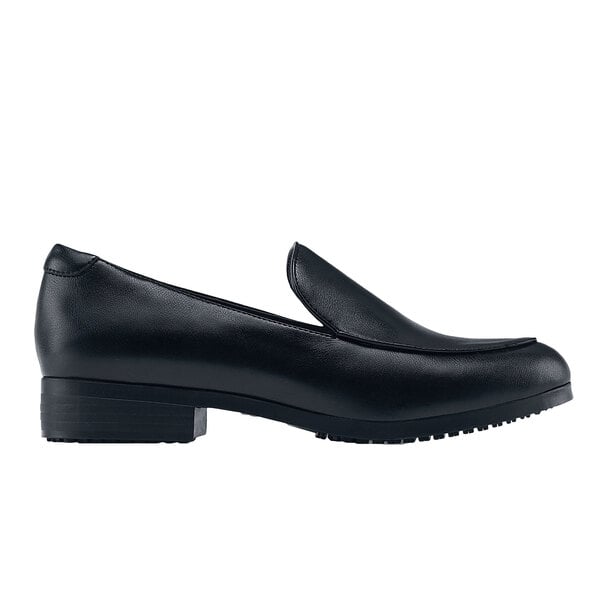 A black loafer shoe with a rubber sole and pointed toe.