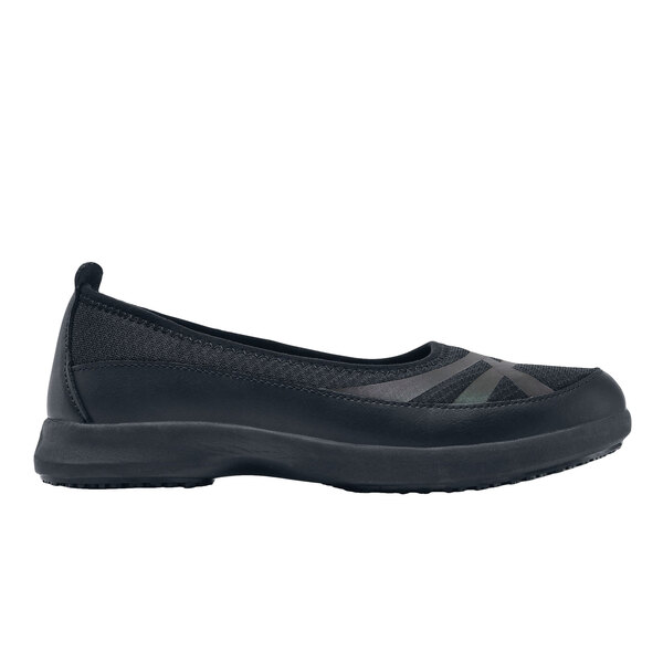 A pair of black Shoes For Crews women's slip-on shoes.