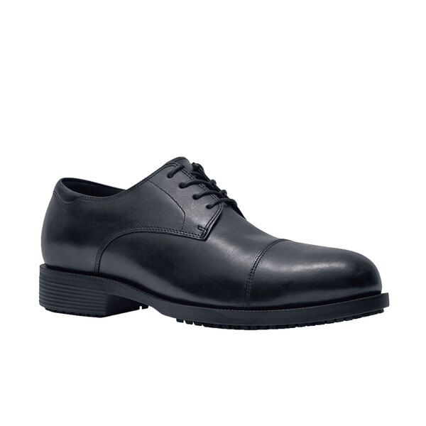 A black Shoes For Crews Senator men's dress shoe with laces and a rubber sole.