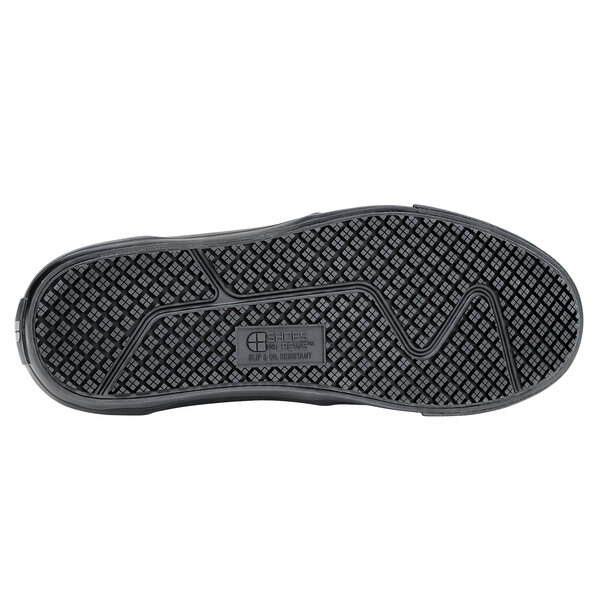 A black Shoes For Crews shoe sole with rubber tread.