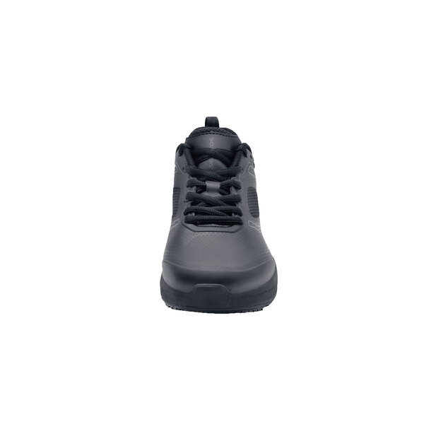 A pair of black Shoes For Crews athletic shoes with laces.