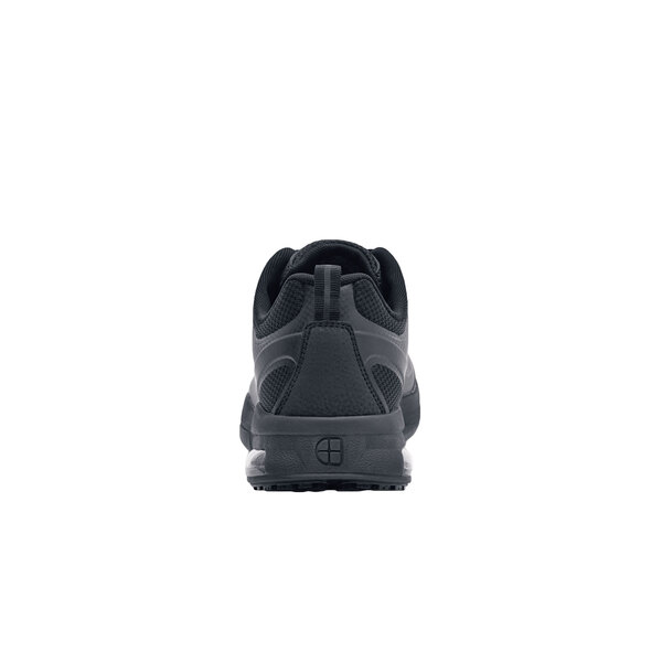 A black Shoes For Crews women's athletic shoe with a non-slip sole.