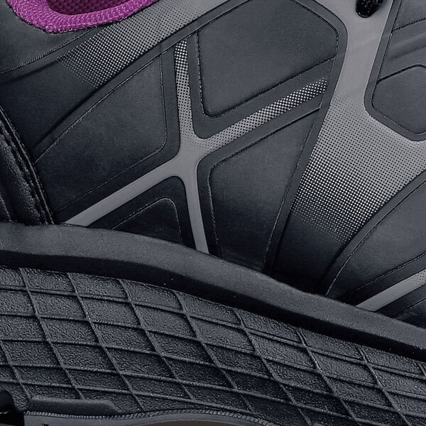 The back of a black women's ACE water-resistant athletic shoe with purple accents.