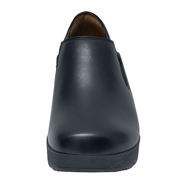 A black leather Shoes For Crews Kelsey women's shoe with a rubber sole.