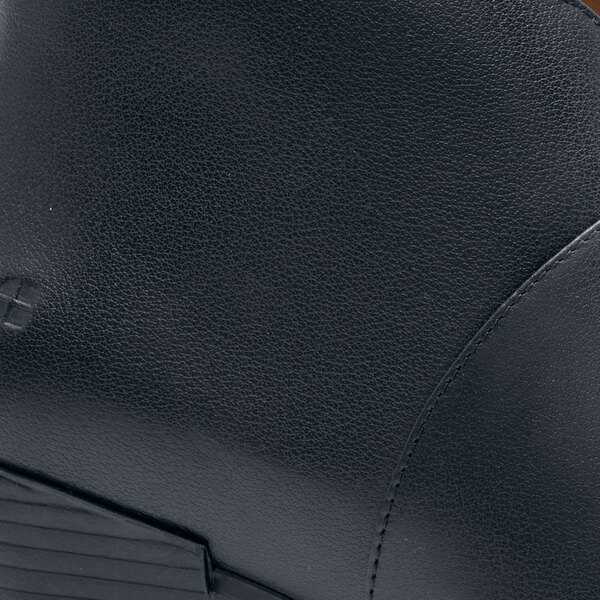 A close up of a black leather Shoe For Crews Delilah shoe.