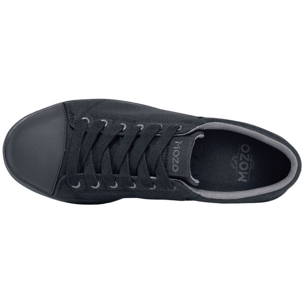 A close-up of a black MOZO casual shoe with laces and a white sole.