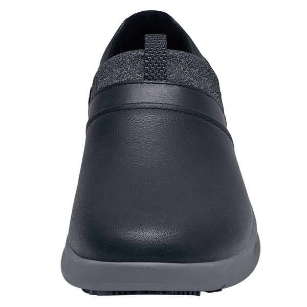 a black shoe with a white background