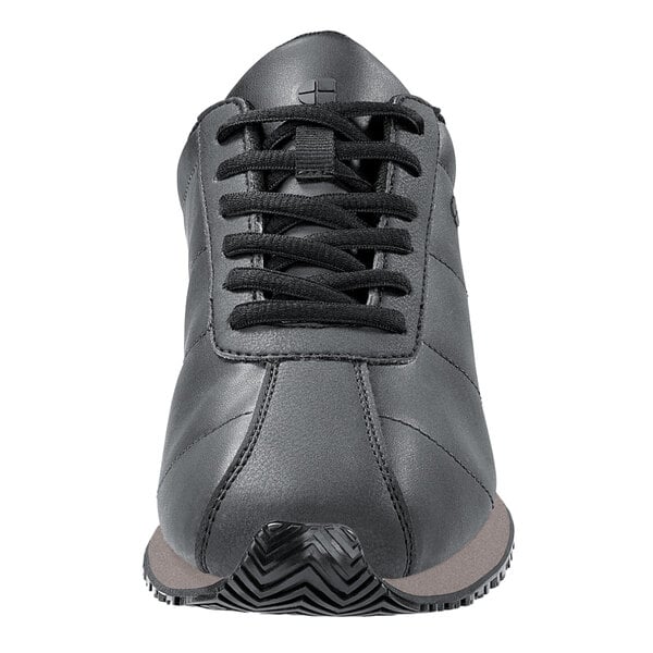 A black leather Shoes For Crews Avery athletic shoe with black laces and a rubber sole.