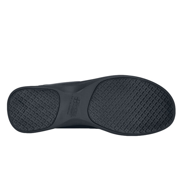 A close-up of a black Shoes For Crews Quincy casual shoe.