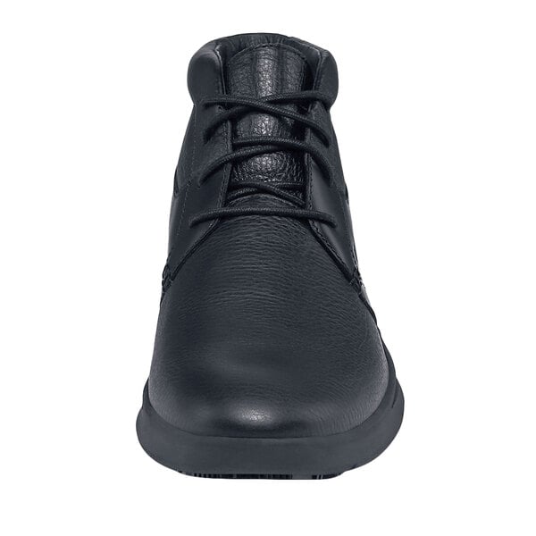 A close-up of a black Shoes For Crews Holden men's shoe with laces.