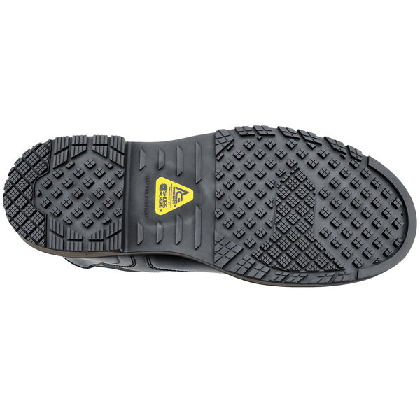 A black ACE Firebrand work boot with a yellow logo.