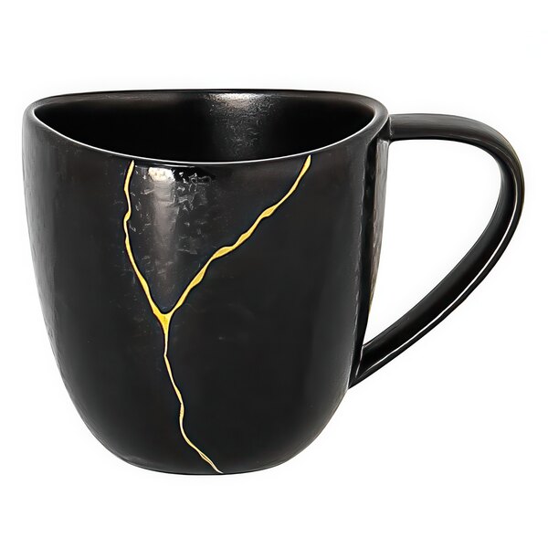 A black porcelain espresso cup with gold crack detail.