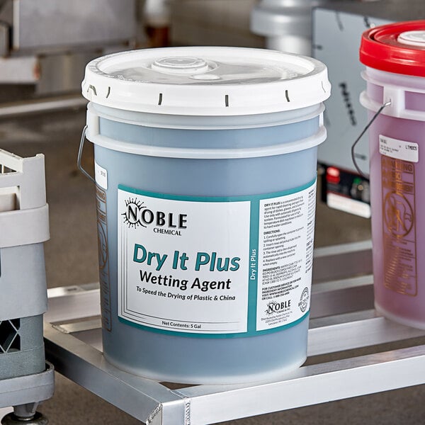 A white container of Noble Chemical Dry It Plus.