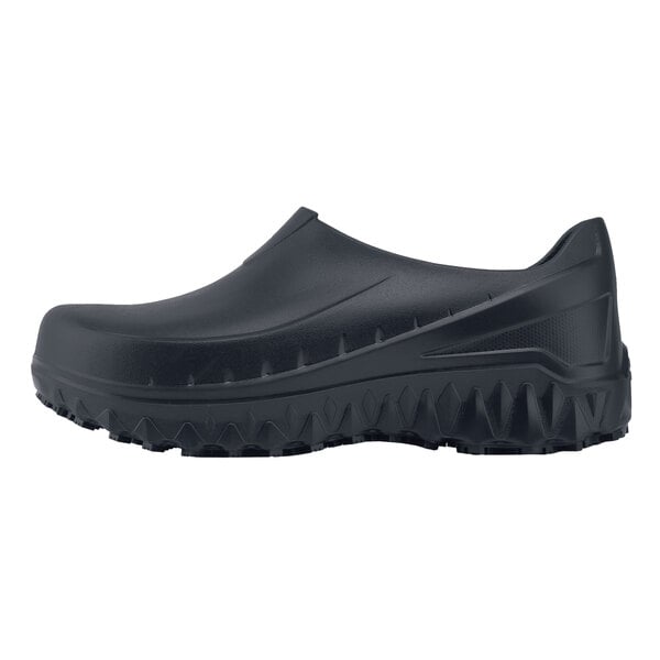 A black Shoes For Crews men's clogger shoe with rubber soles.