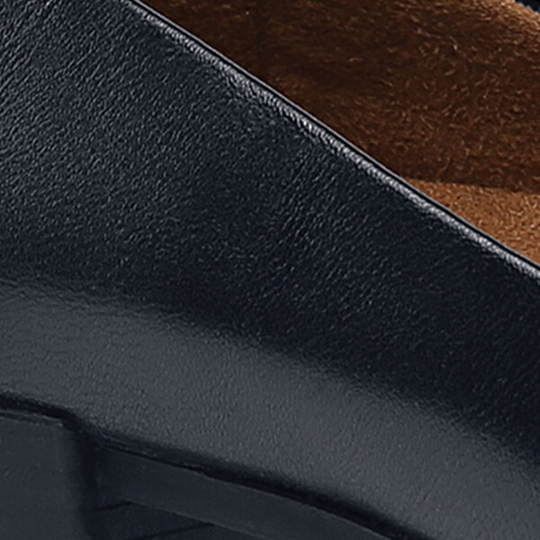 A close up of a black Shoes For Crews Willa women's dress shoe with a leather surface.