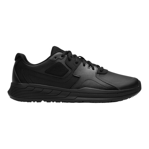 A black Shoes For Crews men's athletic shoe with a black sole.