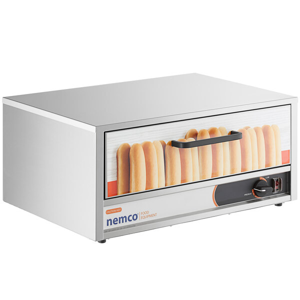 A white rectangular Nemco hot dog bun warmer with a picture of hot dogs on it.