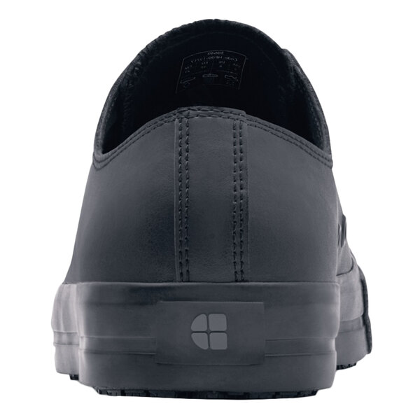 A black leather Shoes For Crews Delray women's casual shoe with a rubber sole and logo.