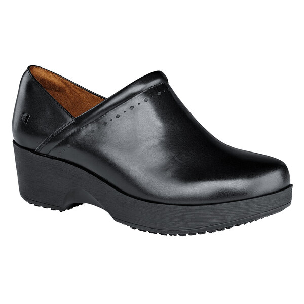 A black leather Women's Shoes For Crews shoe with a thick rubber sole.