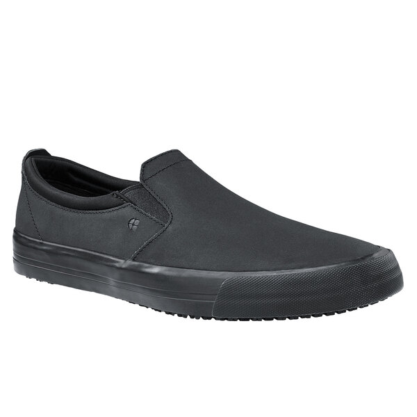 A black slip-on Shoe For Crews with a black rubber sole.