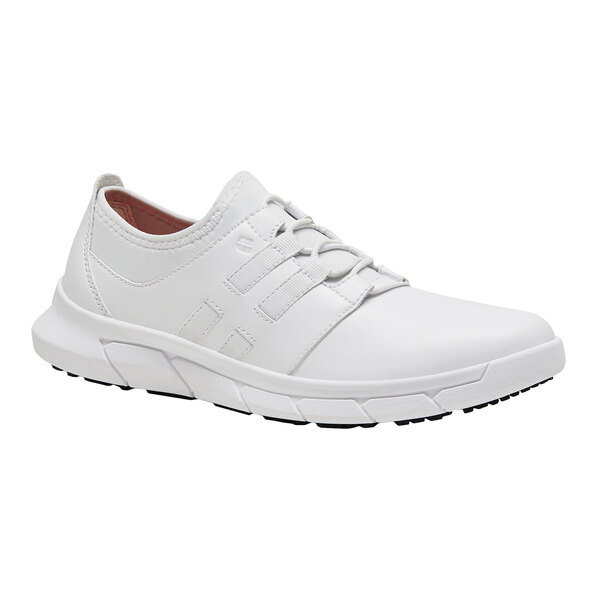 A white Shoes For Crews women's athletic shoe with white laces.