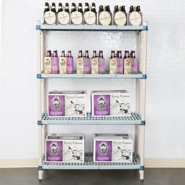 A MetroMax Q shelf with boxes and bottles of beer on it.