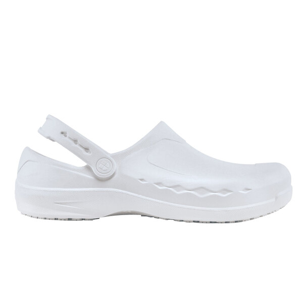 A white slip-on shoe with a button on a white background.