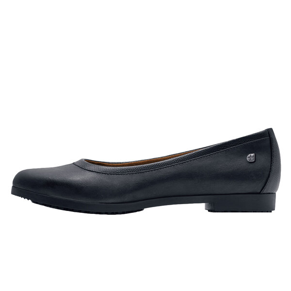 A black flat shoe with a black sole.