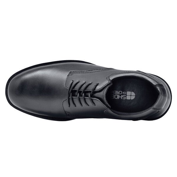 A black leather men's dress shoe with laces.