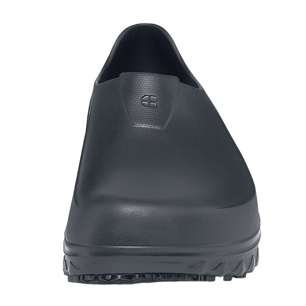 A close up of a black Shoes For Crews men's casual shoe with rubber soles.