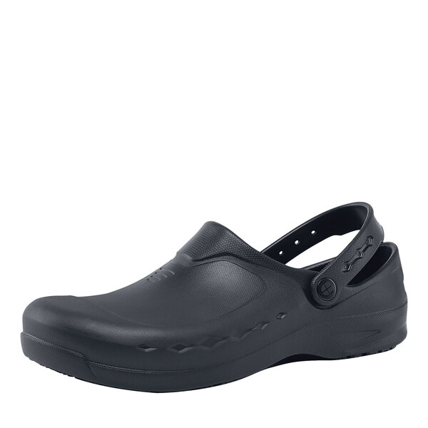 A black Shoes For Crews clogger shoe with a rubber sole.